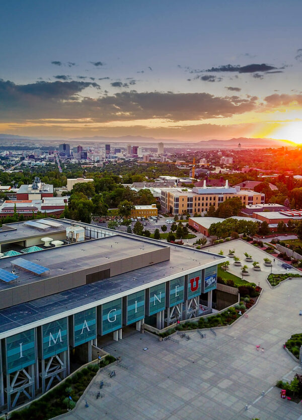 DJI_0133-HDR-600×833 aerial shot of campus at sunset with a focus on the library, and downtown Salt Lake in the background