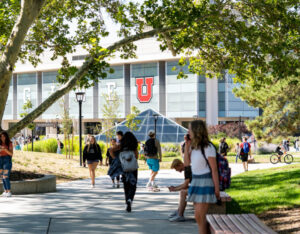 scene of campus, with many students traveling to various places