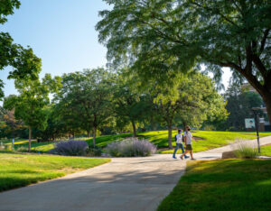 a group of students in the background walking to their class