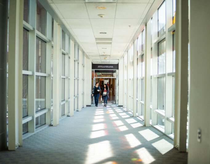 Health-Sciences-Ed-030420-4_2000-682×532 one of the hallways on campus with tall open windows