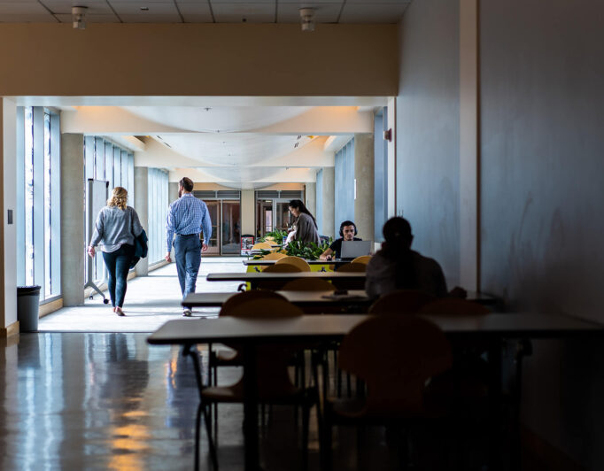 study-time-1-682×532 students studying at tables along a hallway