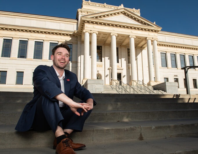 00-cover-Jack-OLeary-682×532 the student body president on the steps in front of the main building on campus