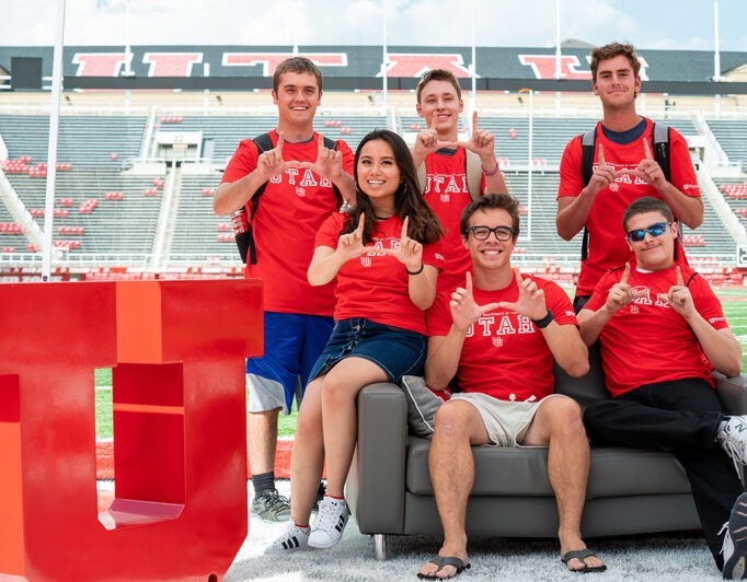 10-collage-Student-orgs-682×532 a group of students making the U hand sign with a block U to the side