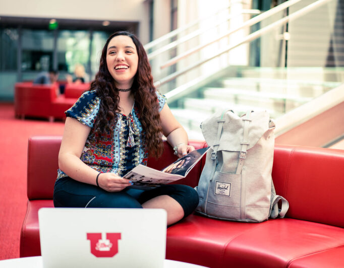 Admissions-Lifestyle-JLO-59_2000-682×532 a student in a common area reading a magazine