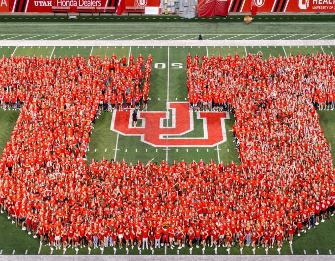 Block-U-Class-of-2027-124-682×532 a class of students on the football field making the shape of the block U across the field