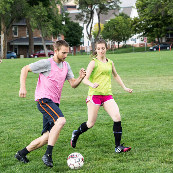 a couple of student playing soccer