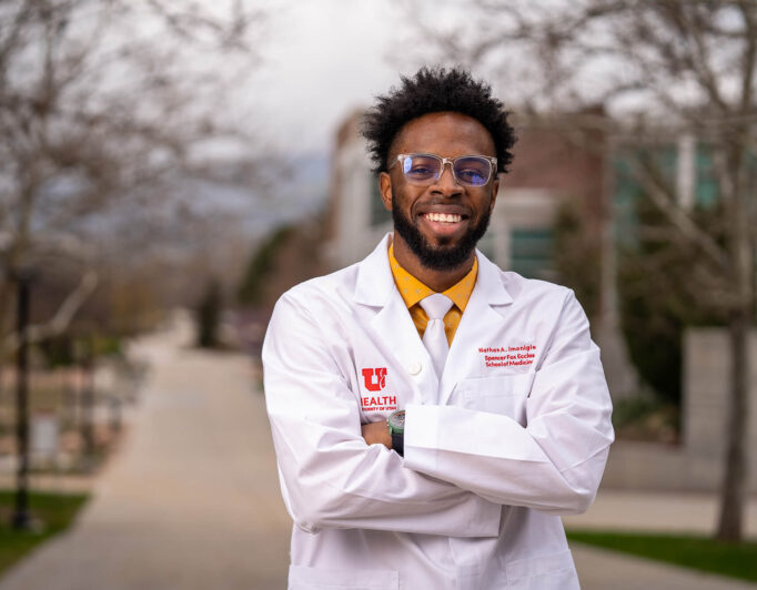 Student-Scholarship-UMFA-27_2000-682×532 a student in a lab coat smiling