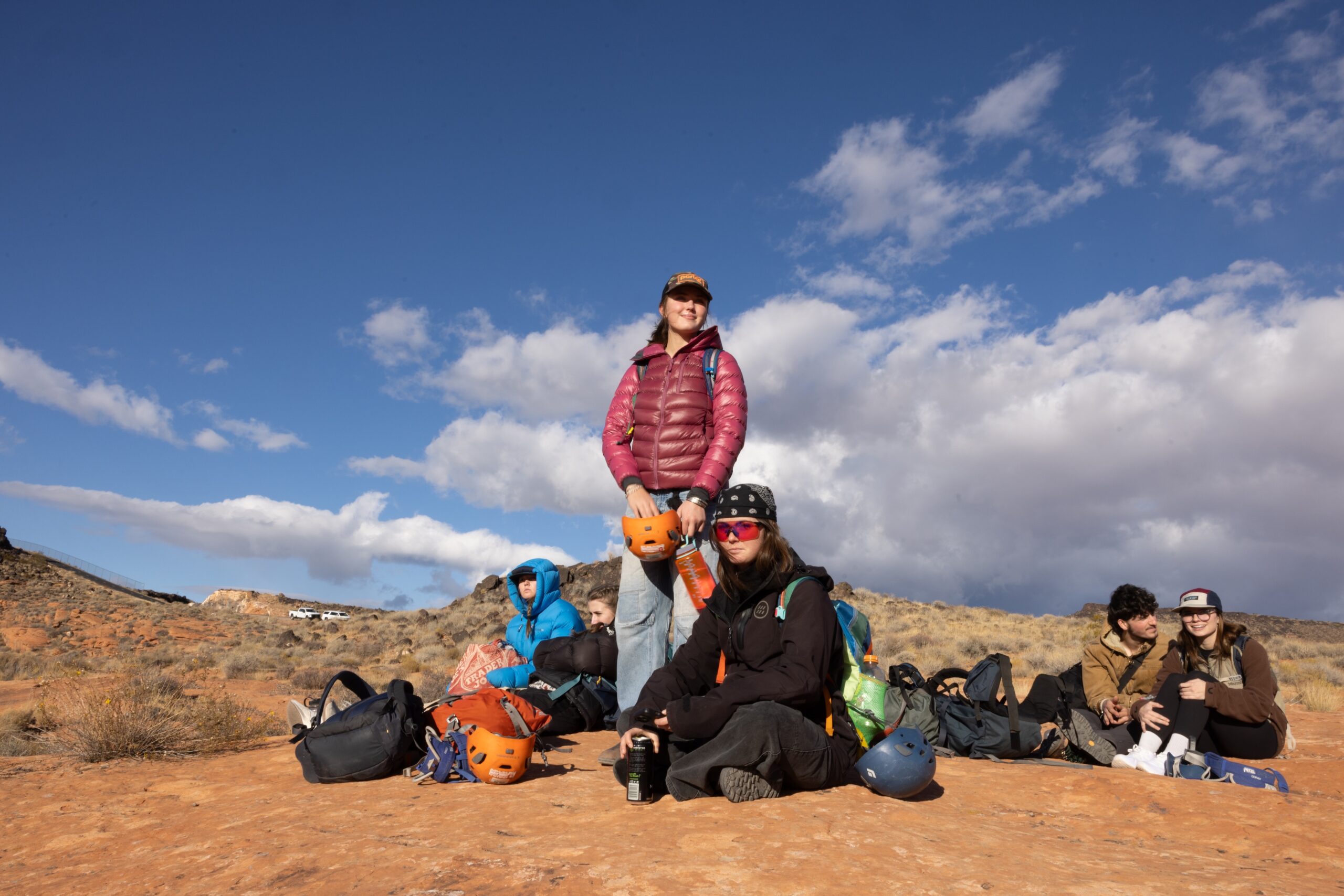 a few students relax with their gear between climbing sessions